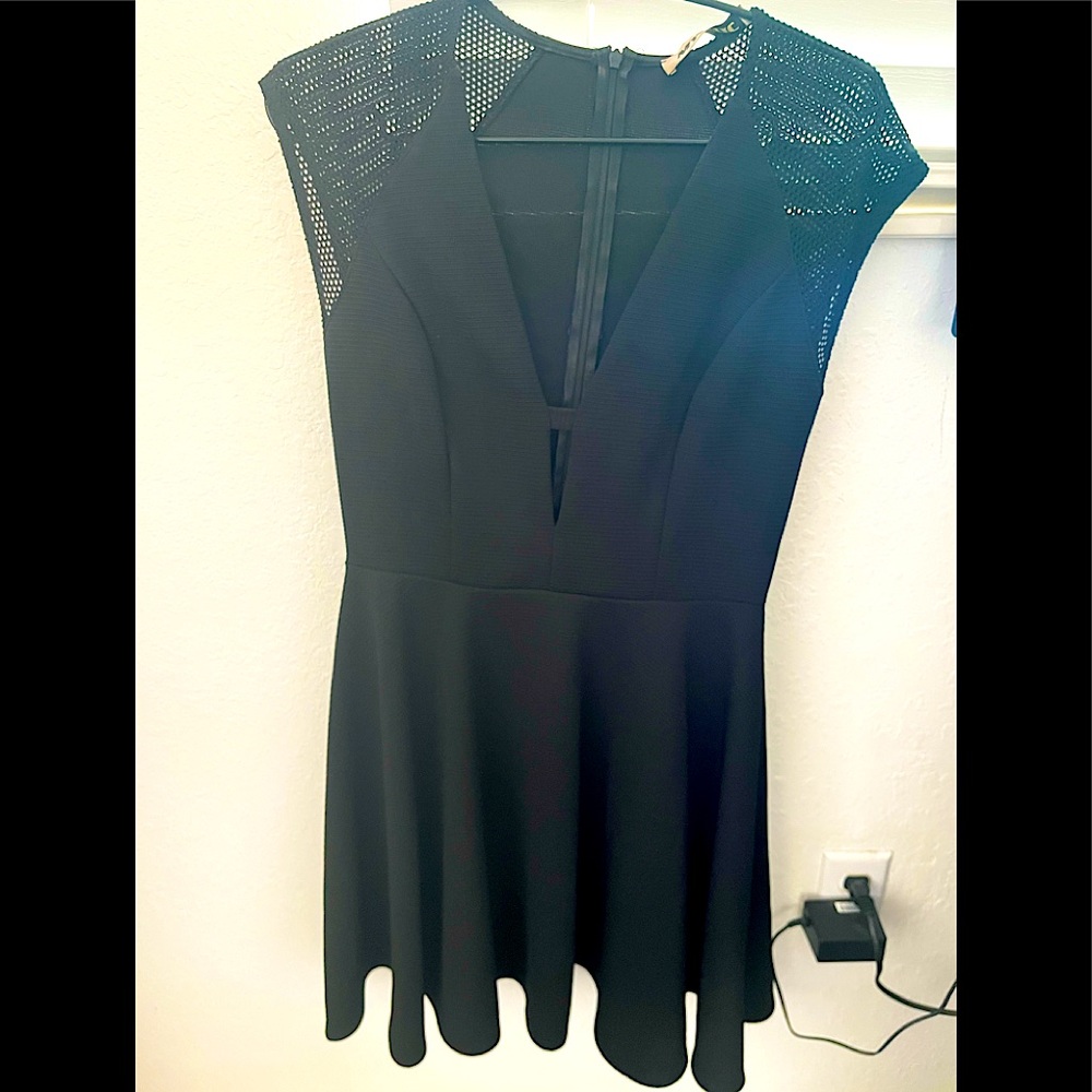 Black dress with cut out on the front size 6 never used